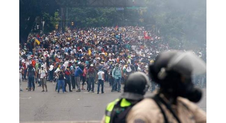 Venezuela pro-government protester dies, raising toll to 21 