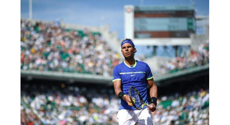Tennis: Nadal, Djokovic march on as Muguruza survives 