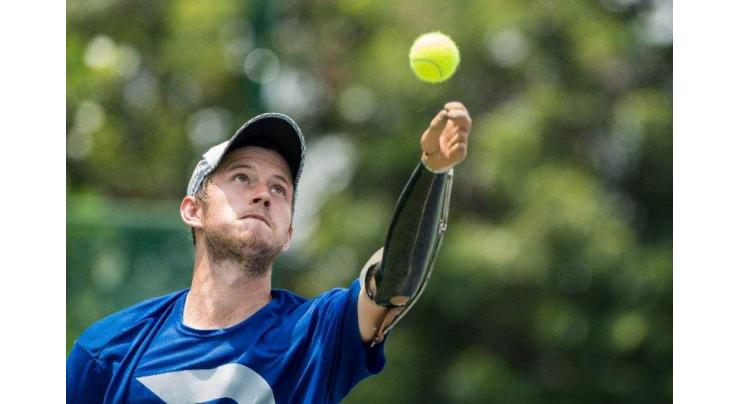 One-armed Kiwi climbs professional tennis ranks 