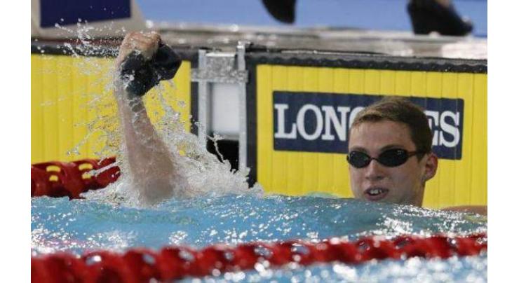 Proud stunned to win 50m butterfly world title 