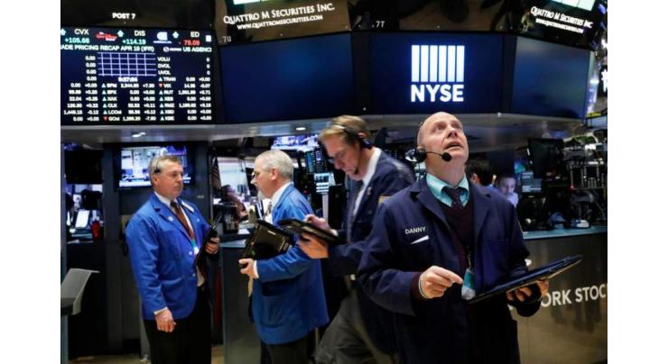 Strong earnings lift Dow, but Nasdaq hit by Alphabet 