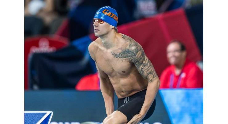 Swimming: Dressel wins men's 100m butterfly world title 
