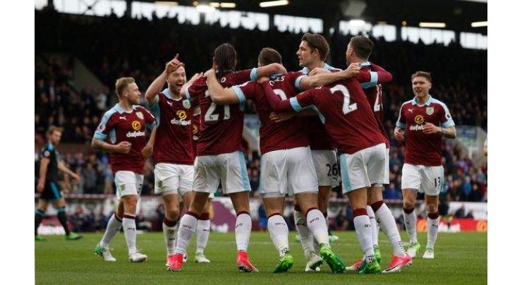 Football: Burnley stun nine-man Chelsea, Huddersfield go top 
