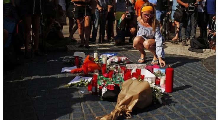 Catalan president warns Spain attack suspect still at large 