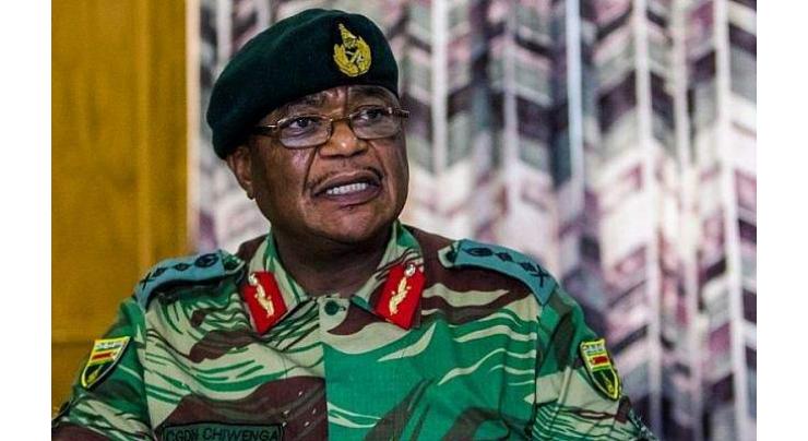 Military on streets near Zimbabwe capital as treason claims fly 