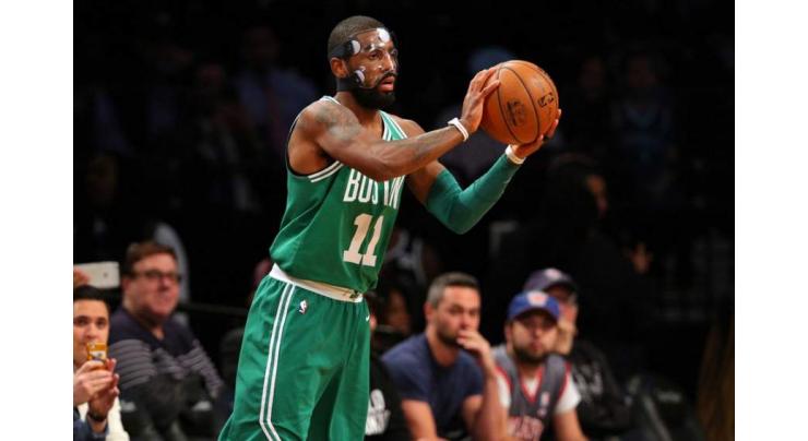 NBA: Masked-man Irving leads Celtics to 13th win in a row 