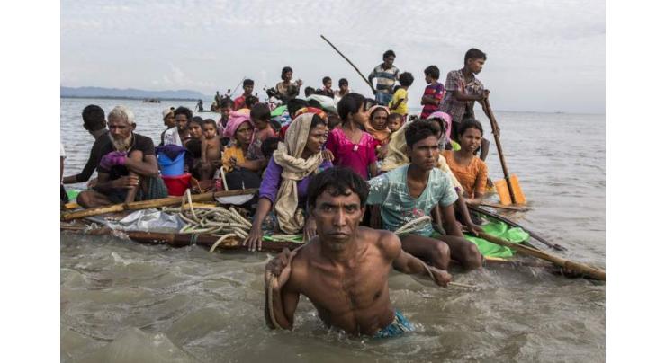 Desperate Rohingya Muslims use home-made rafts to get to Bangladesh UN 