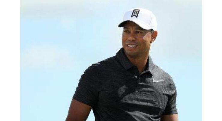 Golf: Woods in hunt as Hoffman romps 
