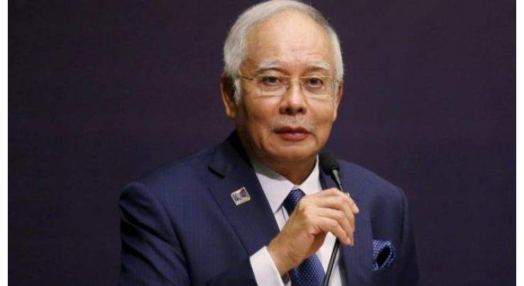 Malaysian PM puts party on war footing before polls 