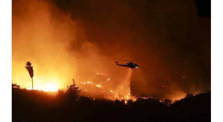 Monster fire slows as California homeowners pick up pieces 