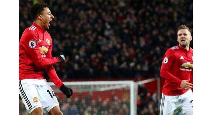 Football: Lingard rescues United, record breaker Kane hits treble 