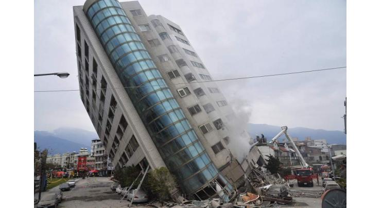 Taiwan demolishes quake-hit buildings as rescue efforts intensify 