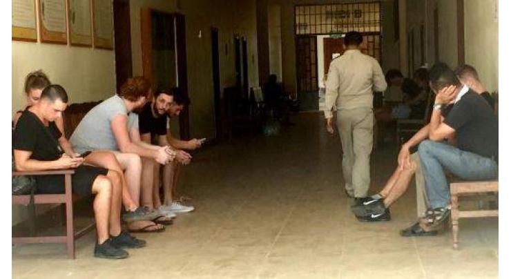 Cambodia court drops pornography charges against foreigners 