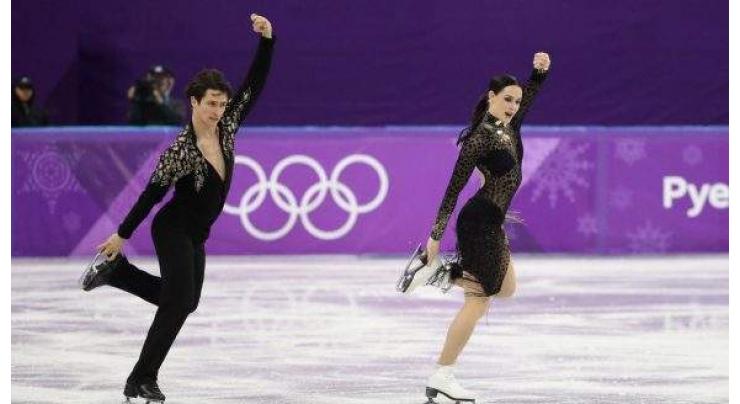 Games face new doping blow as Canadian skaters serve up magic 