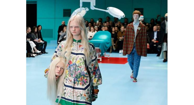 Gucci models carry replicas of heads at Milan Fashion Week 