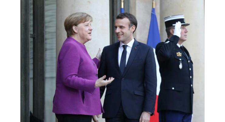 Macron, Merkel promise EU reform roadmap by June
