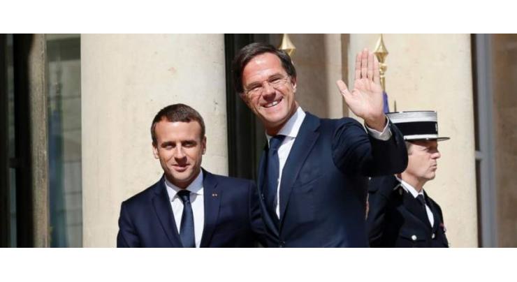 On EU summit eve, Macron visits Dutch PM to talk reform
