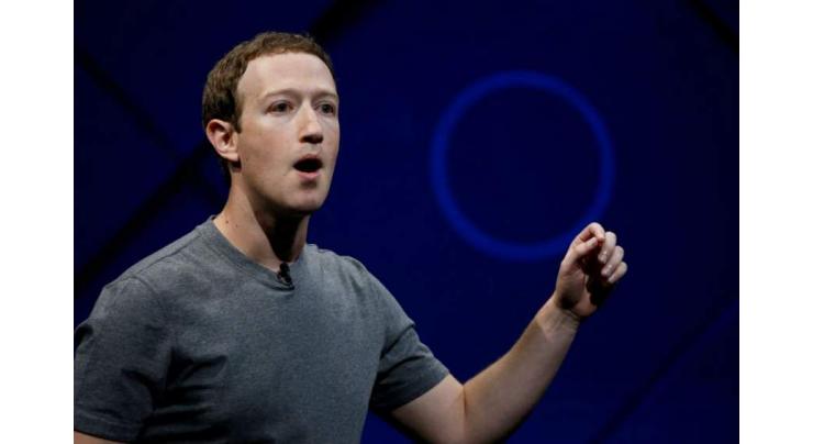 As Facebook scandal mushrooms, Zuckerberg vows to 'step up'
