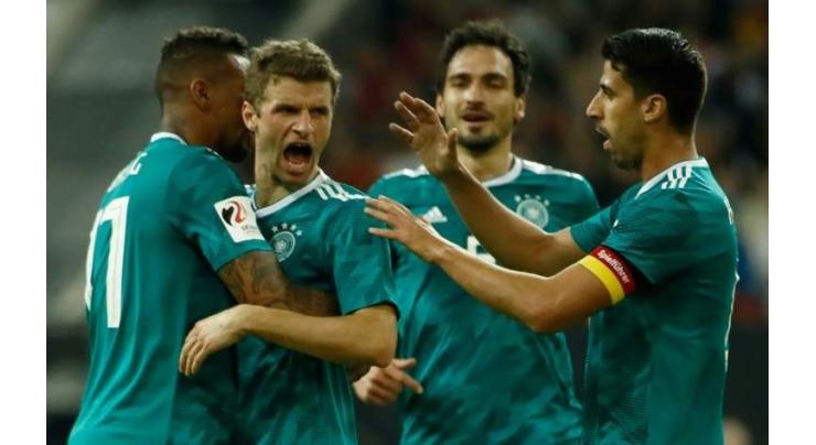 Mueller super strike earns Germany draw with Spain
