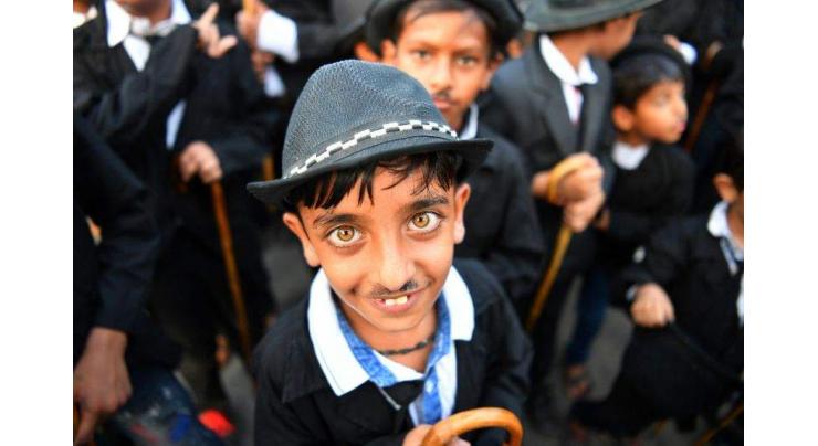 The Great Impersonators: Charlie Chaplin fans parade through Indian town
