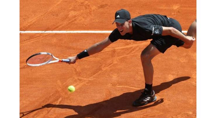 Thiem saves match point in victory over Rublev
