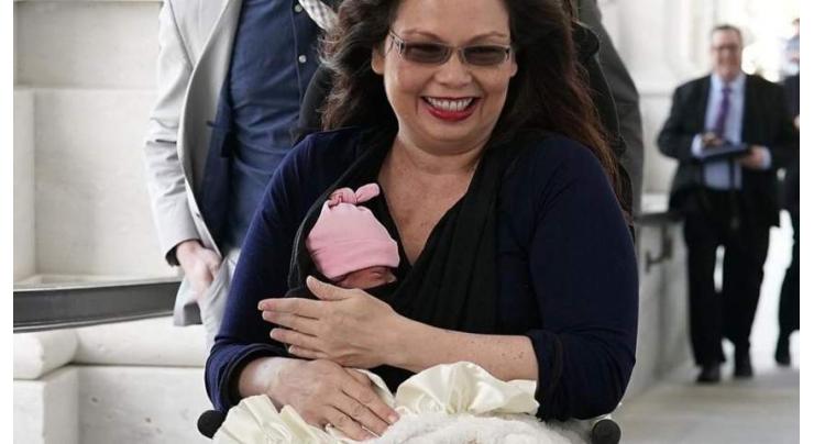 History made: US senator brings 'first baby' for confirmation vote
