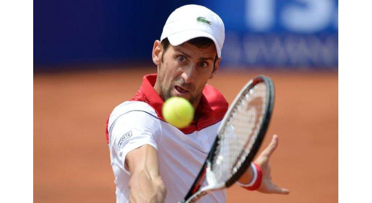 Djokovic in surprise Barcelona defeat, no sweat for Nadal

