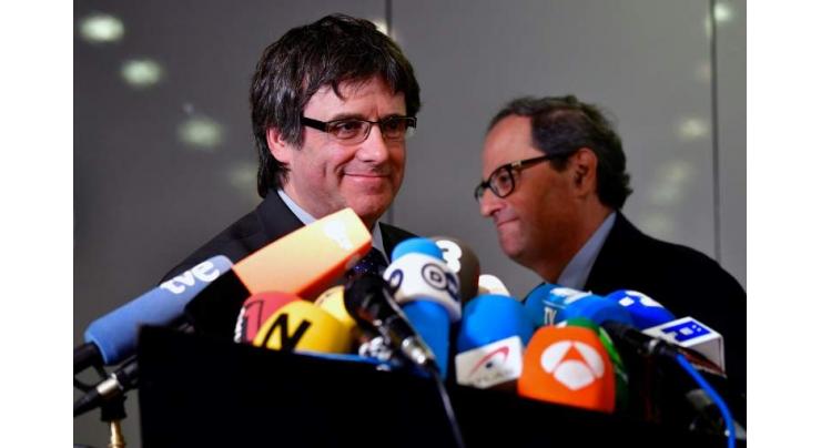 New Catalan leader asks to meet Spain PM, 'xenophobia' row grows
