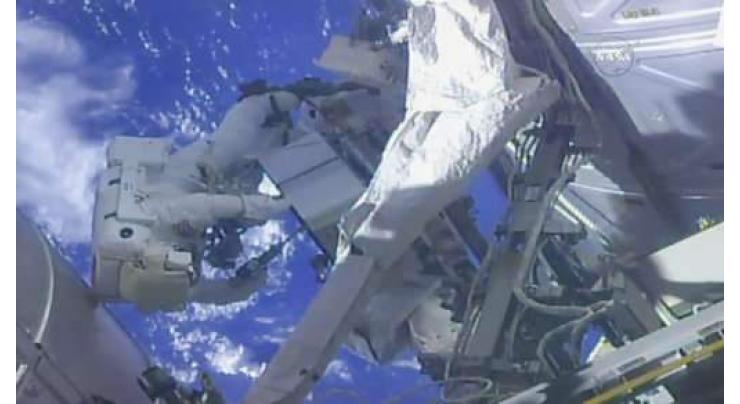 US spacewalkers swap, check coolers 'Leaky' and 'Frosty'
