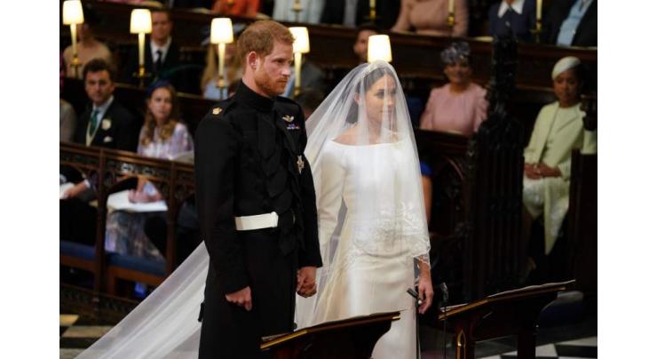 Harry and Meghan hold hands at emotional wedding service
