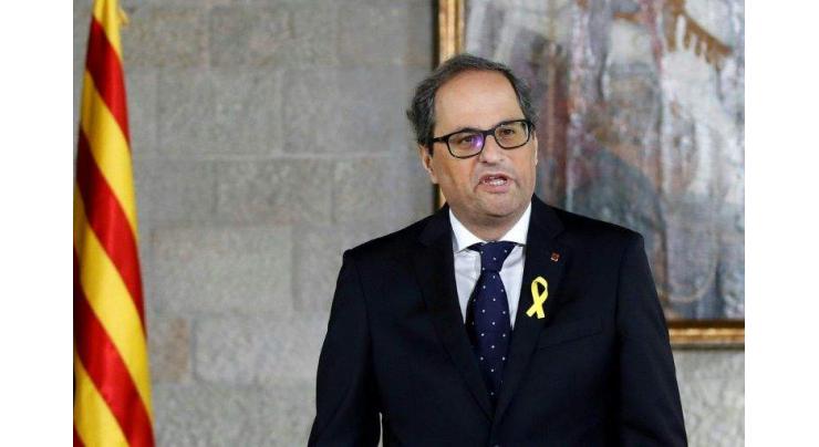 Catalan president names jailed, exiled ministers to govt
