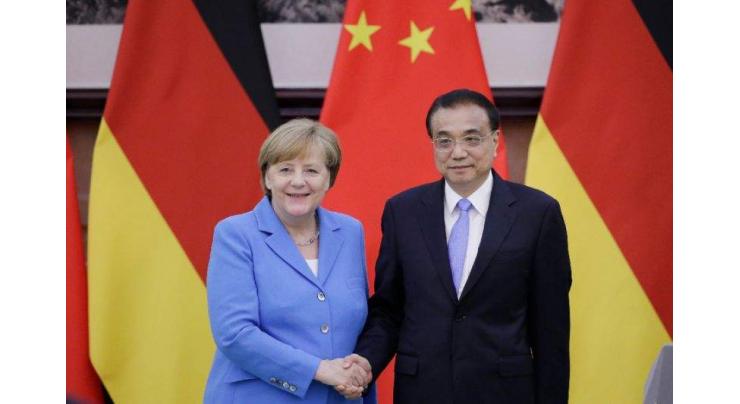 Angela Merkel, Chinese premier defend Iran deal, free trade
