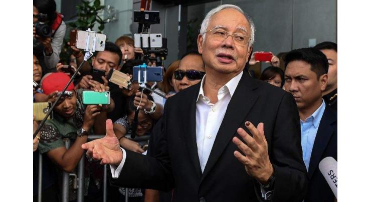 Almost $30 million, 400 handbags seized in raids linked to Malaysia's Najib
