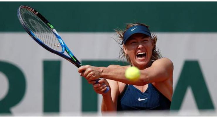 Sharapova edges closer to French Open duel with catsuit Serena
