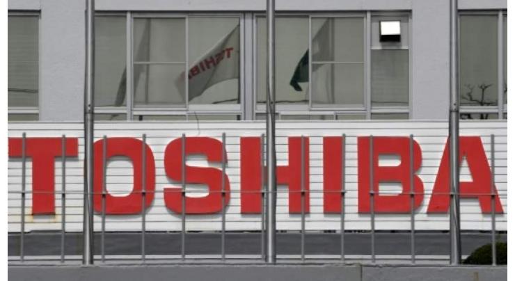 Toshiba completes $21 bn sale of chip unit
