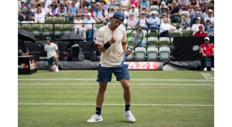 Pouille survives nervous moments to beat Istomin
