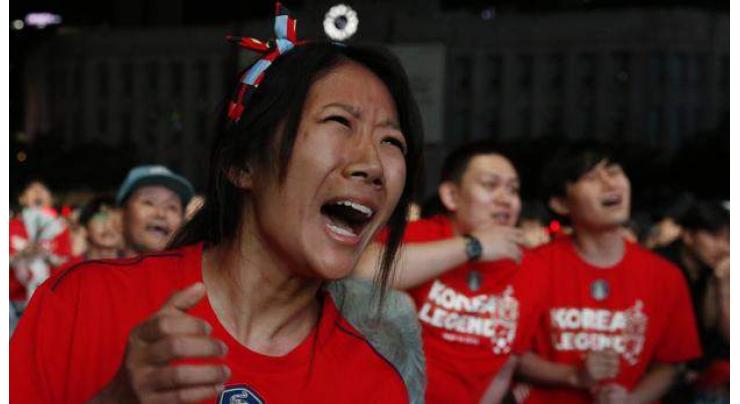 Crestfallen S. Korea fans fall silent on World Cup defeat
