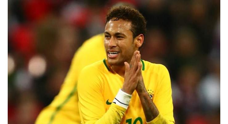 Neymar limps out of training, setting Brazilian alarm bells ringing
