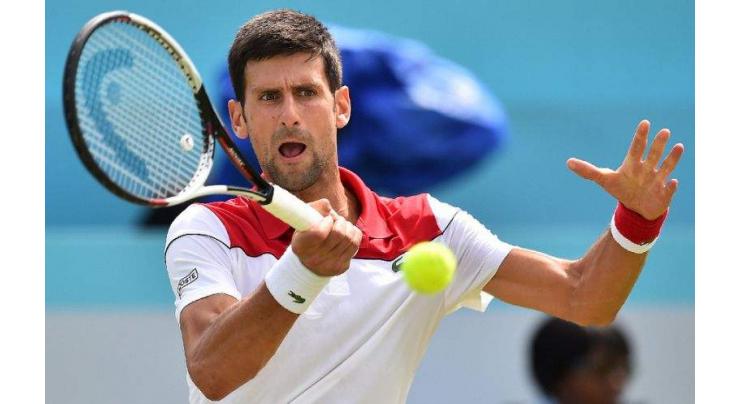 Djokovic cruises at Queen's, Murray set to return
