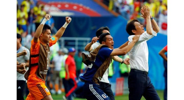 Japan put party on hold after making World Cup history
