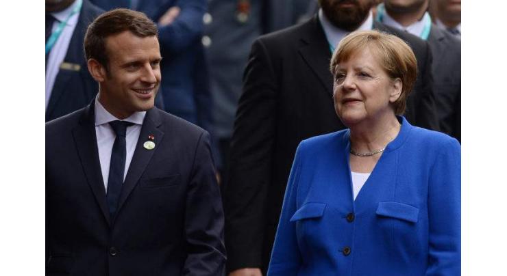 Macron wins Merkel's backing on budget for eurozone

