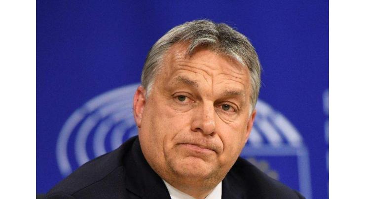 Hungary adopts law penalising migrant aid groups

