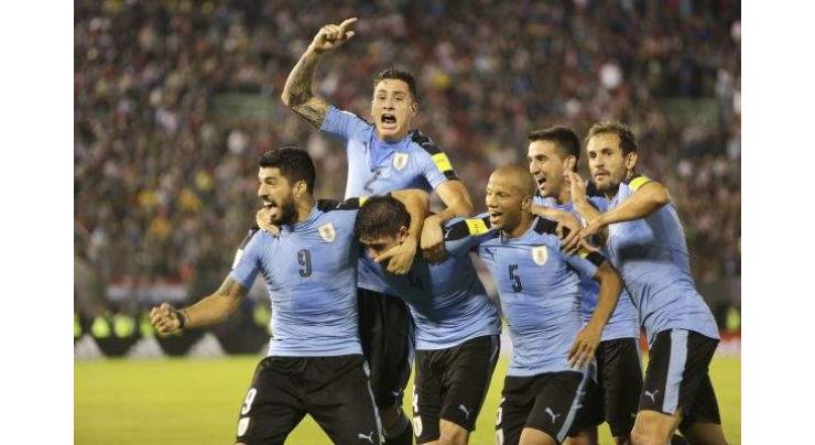 Uruguay top World Cup Group A, Russia second after 3-0 defeat
