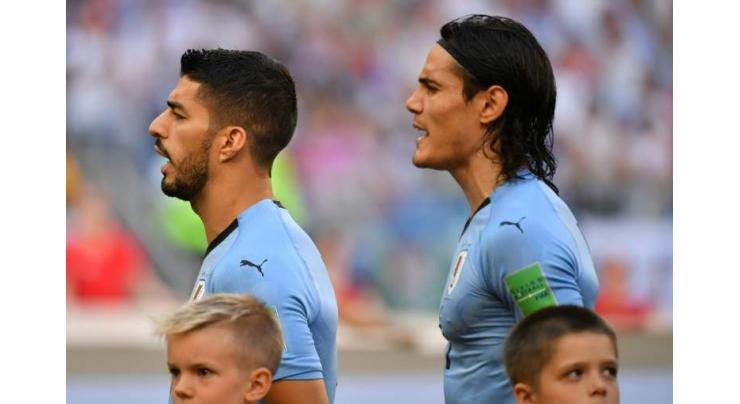 Uruguay top World Cup group as Spain, Portugal target knockouts
