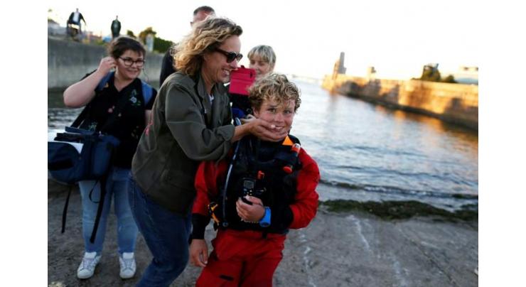 Schoolboy, 12, gets hug from mum after record Channel sail
