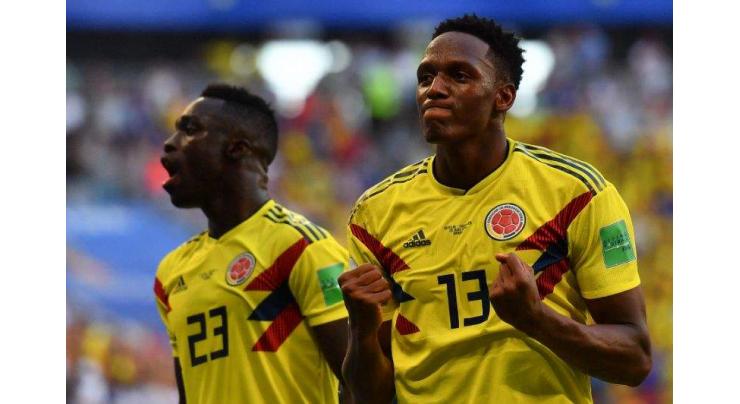 Mina winner sends Colombia through as ill-disciplined Senegal go out

