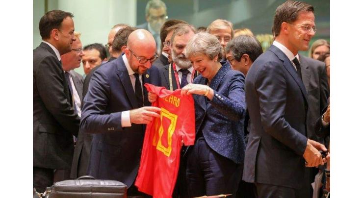 Belgian PM surprises UK's May with World Cup shirt
