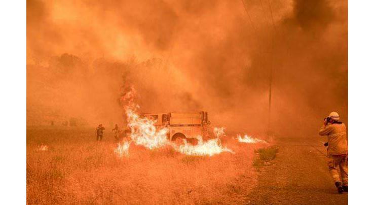 One dead as western US heat wave stunts firefighting efforts
