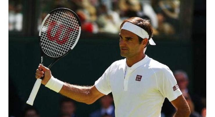 Federer shocked by Anderson at Wimbledon as Djokovic makes semis
