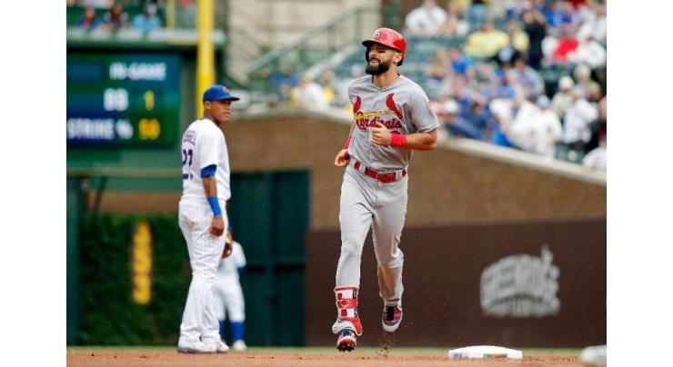 Cards' Carpenter erupts for historic three homers, two doubles

